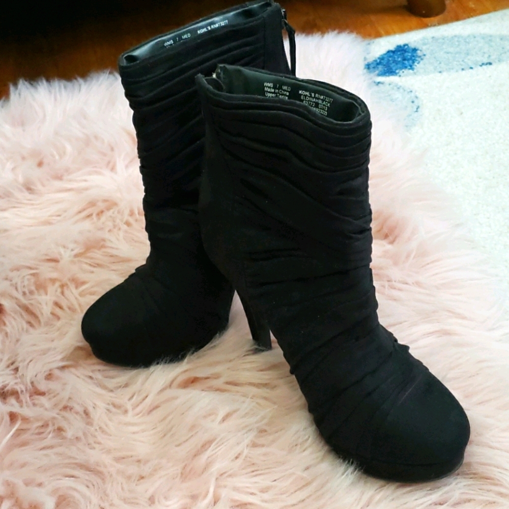 A pair of black booties.